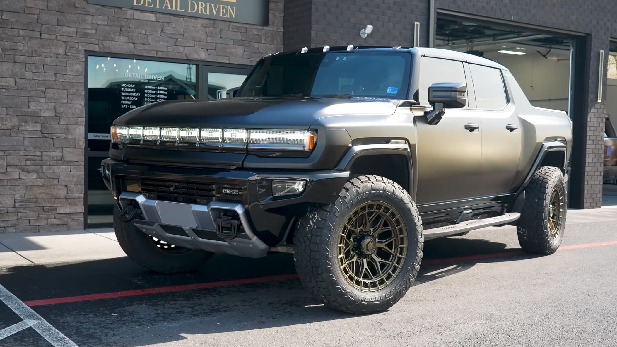 GMC Hummer EV in Satin Perfect Black Color PPF, rear three-quarter hero shot at Detail Driven