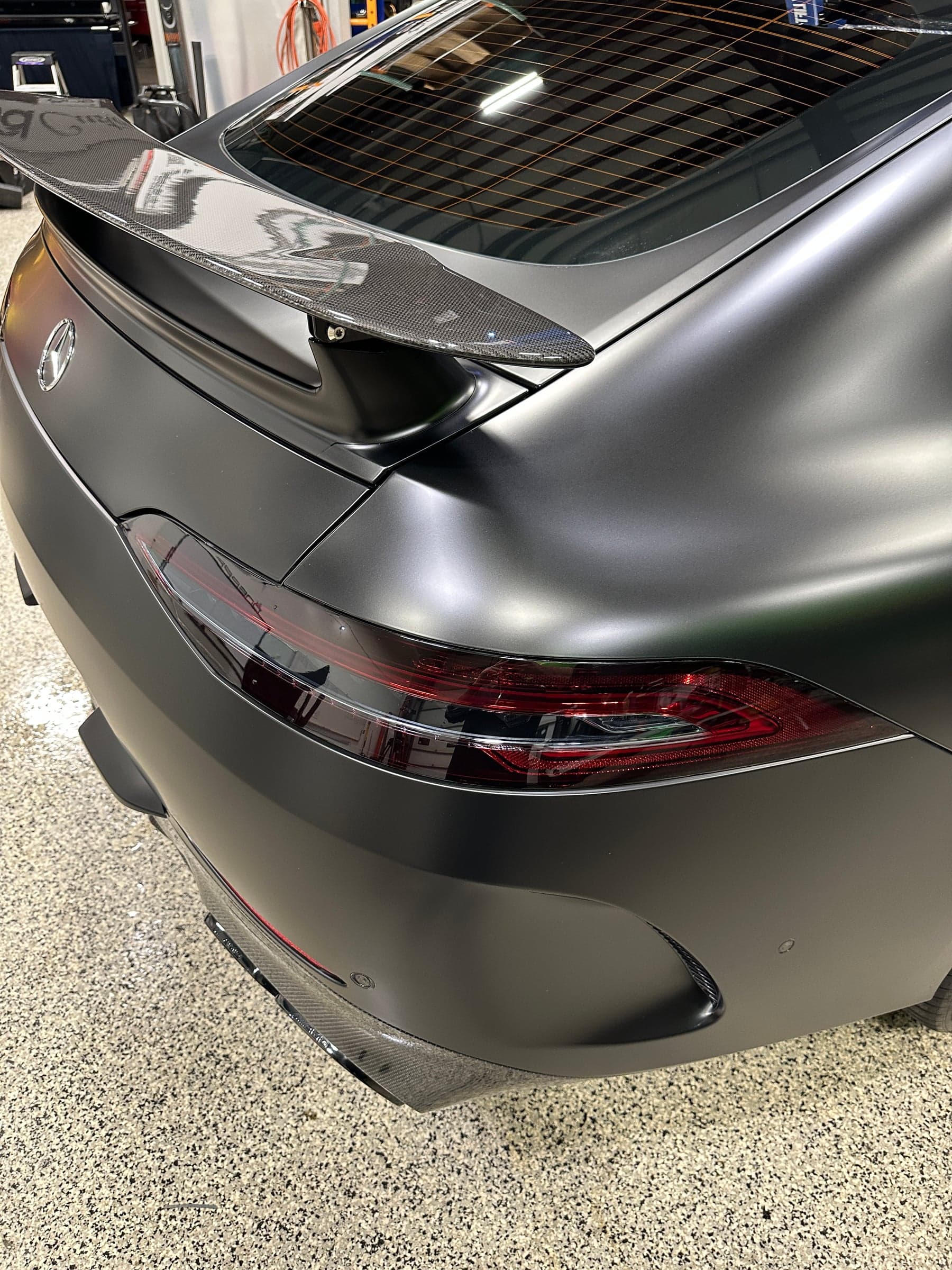 Mercedes-AMG GT63s taillight in Dark Smoke, rear three-quarter angle